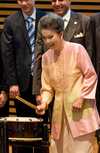 Senator Poy officiating the launch by beating on a Taiko Drum